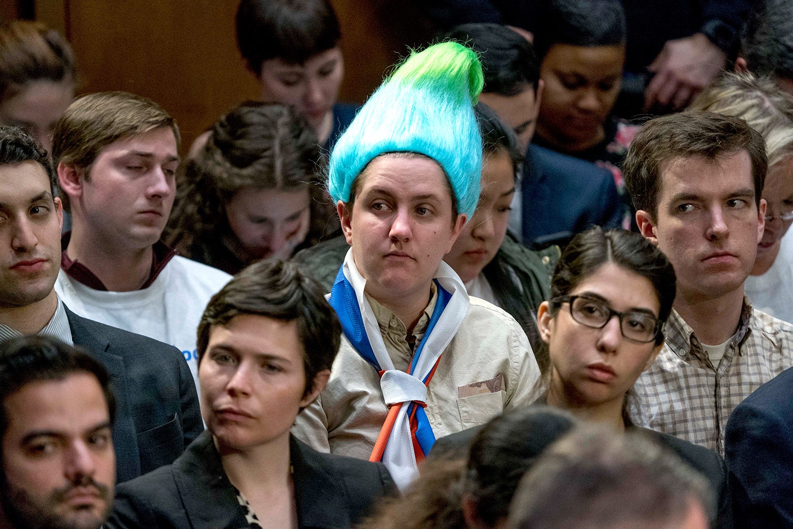 A audience member wearing a blue and green pointy wig, aiming to look like a Russian troll as Facebook CEO Mark Zuckerberg testifies before a joint hearing of the Commerce and Judiciary Committees on Capitol Hill in Washington, Tuesday, April 10, 2018, about the use of Facebook data to target American voters in the 2016 election. 