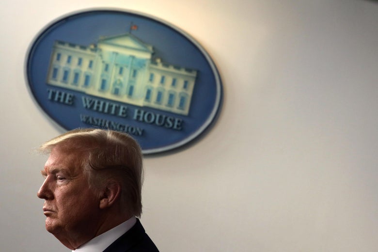 Donald Trump with a White House logo behind him.