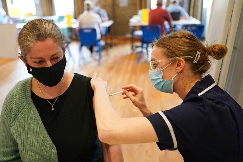 Sarah Robinson-Gay from Hexham receives the Pfizer-BioNTech COVID-19 vaccine at the Hexham Mart Vaccination Centre on May 13, 2021 in Hexham, England. 