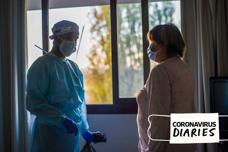 A doctor visits a Covid-19 patient to check their state of health and evaluate their release from the hotel at the Living Place Hotel on November 18, 2020 in Bologna, Italy. 