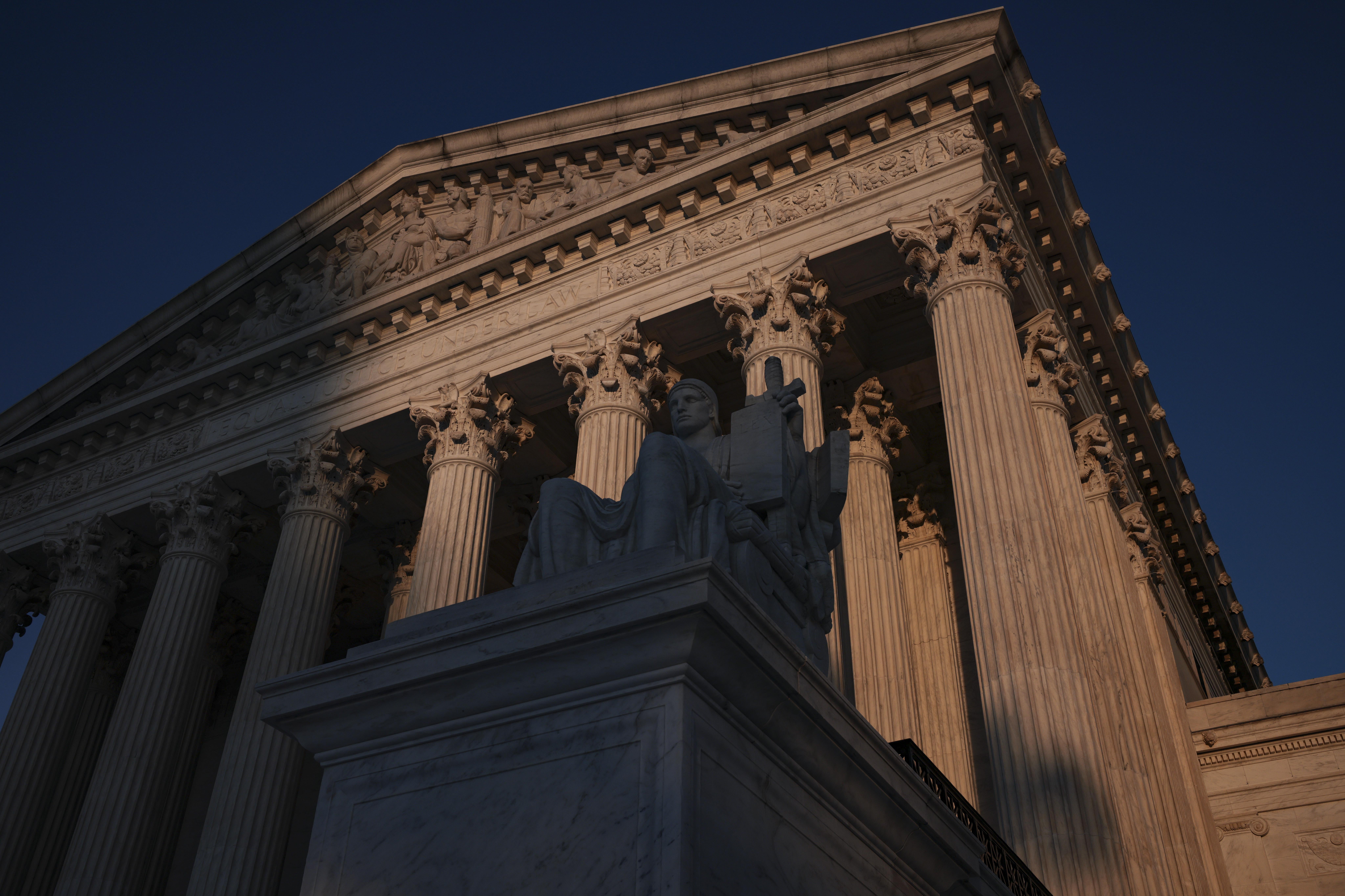 The Supreme Court façade half in shadow.