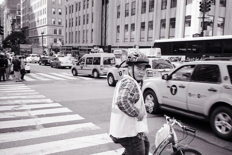 Deliveryman on two wheels, New York.