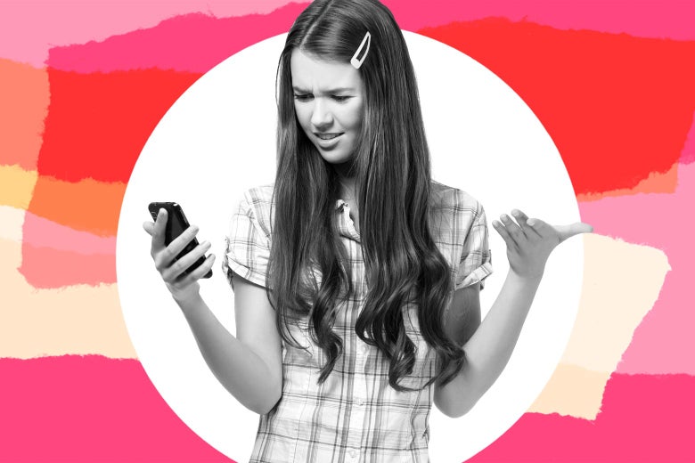 A teen girl looks annoyed at her phone