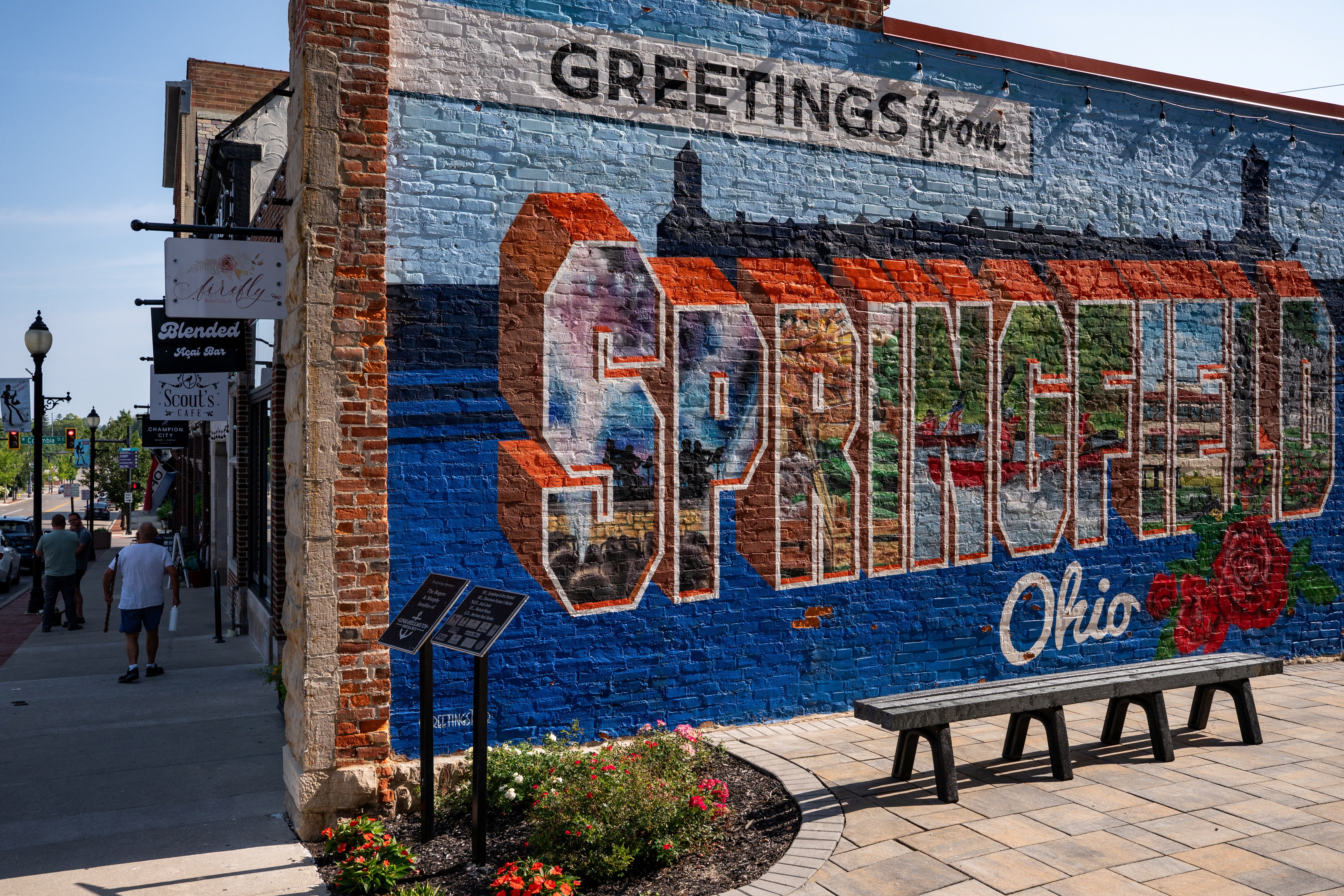 Exterior of a building with a "Greetings from Springfield" mural.