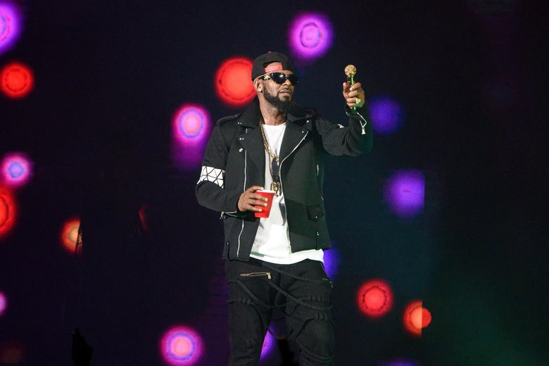 R. Kelly on stage with a red Solo cup