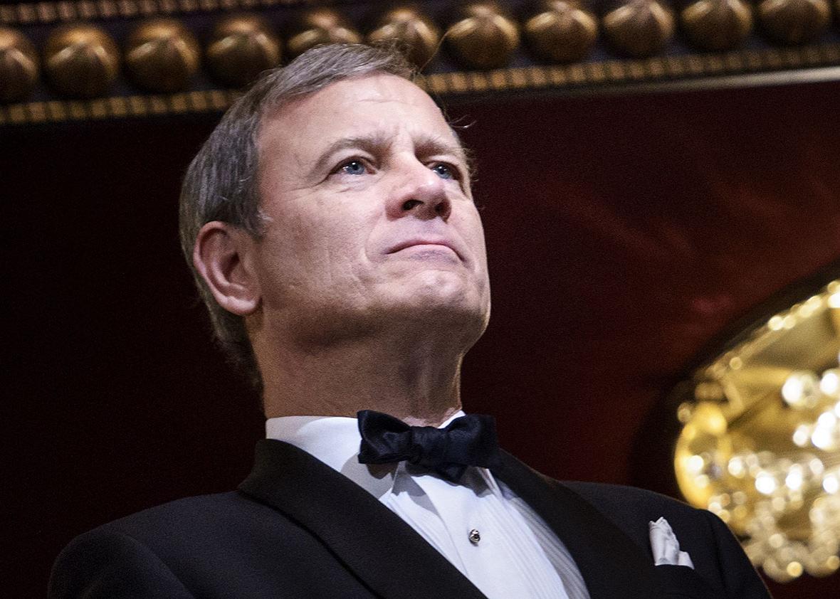 Chief Justice of the US Supreme Court John Roberts listens during the 37th Kennedy Center Honors at the Kennedy Center December 7, 2014 in Washington, DC. 