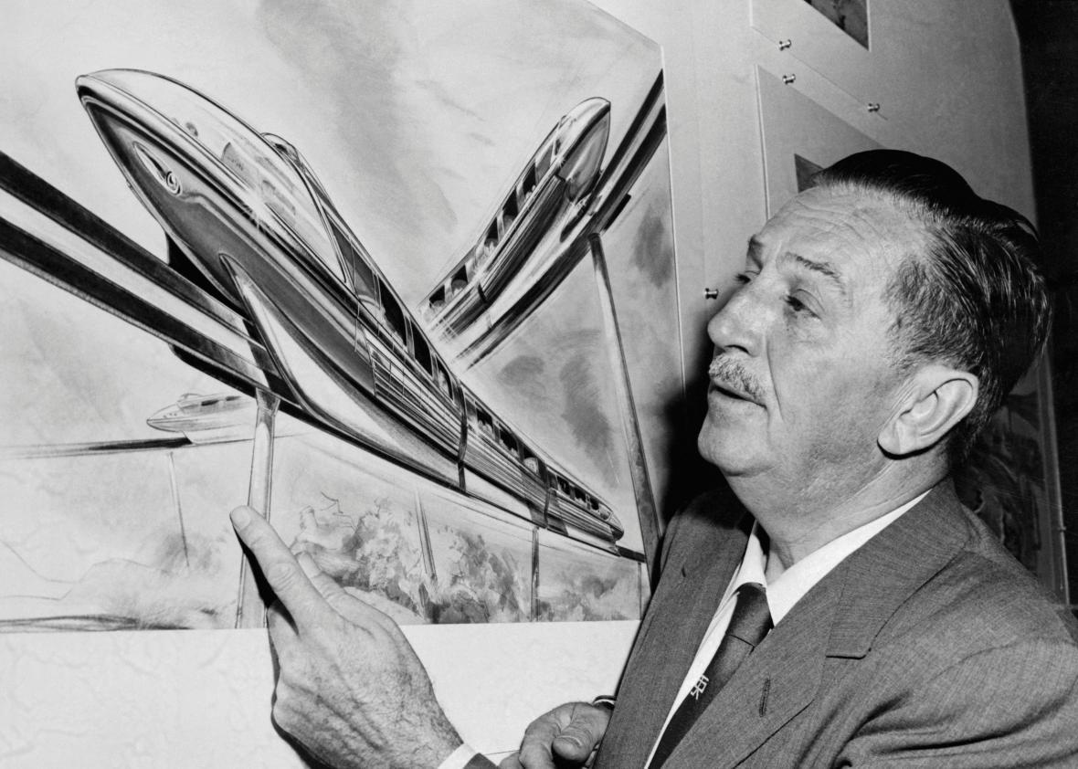 Walt Disney examines an artist's drawing of the futuristic Monorail system which will be in operation at Disneyland.