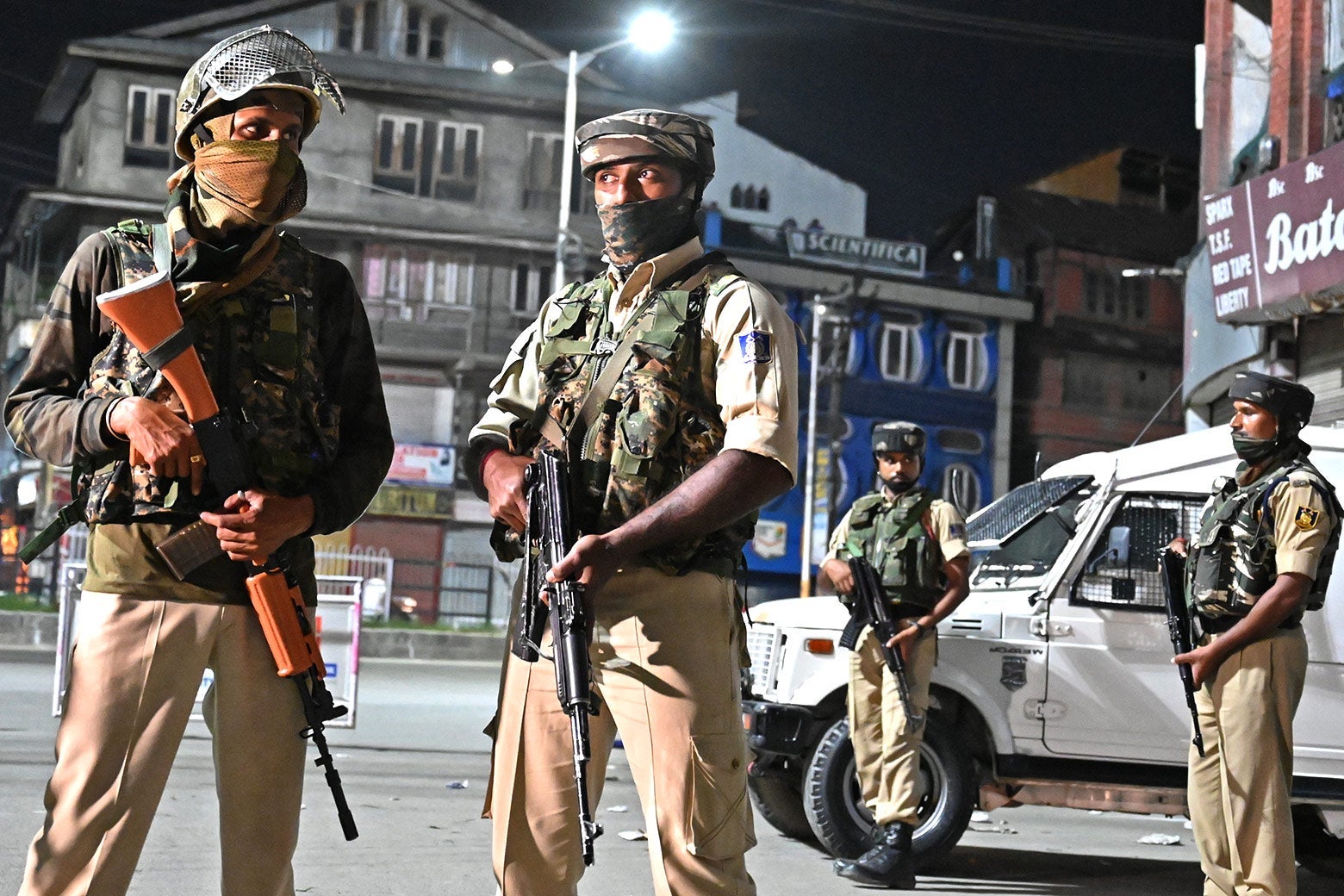 Indian paramilitary troopers stand guard at a roadblock at Maisuma locality in Srinagar on Sunday.