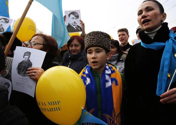 Supporters of Ukraine attend a rally in support of the keeping Crimea a part of Ukraine on March 9, 2014, in Simferopol.