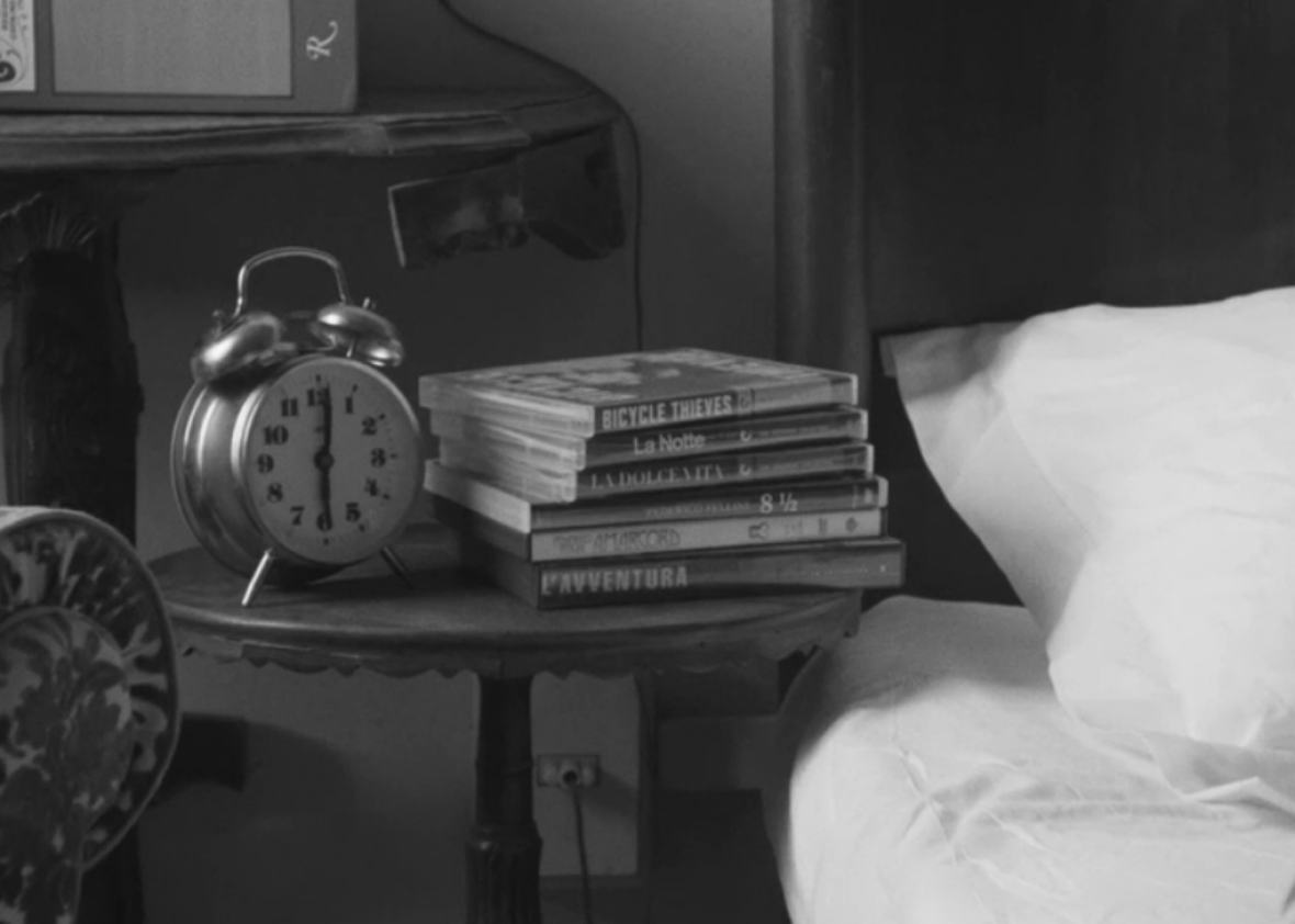 The DVDs on Dev’s nightstand: Vittorio De Sica’s Bicycle Thieves, Michelangelo Antonioni’s La Notte, Federico Fellini’s La Dolce Vita, 8½, and Amarcord, and Antonioni’s L’Avventura