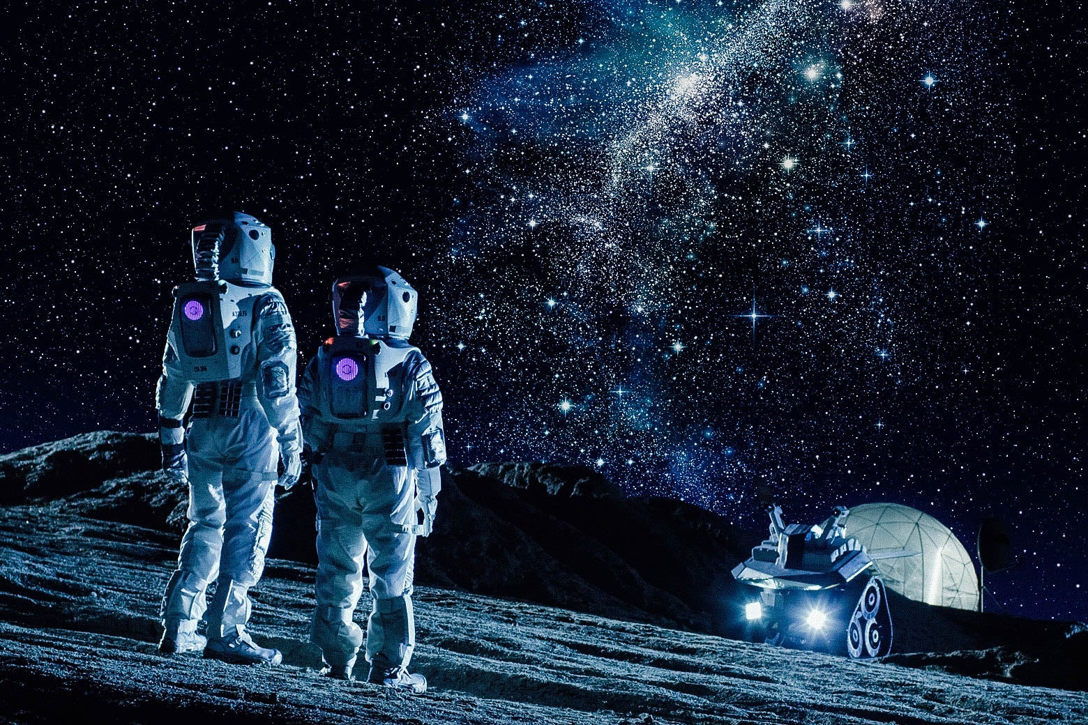 Two people in space suits look out at a rover on a planet. 