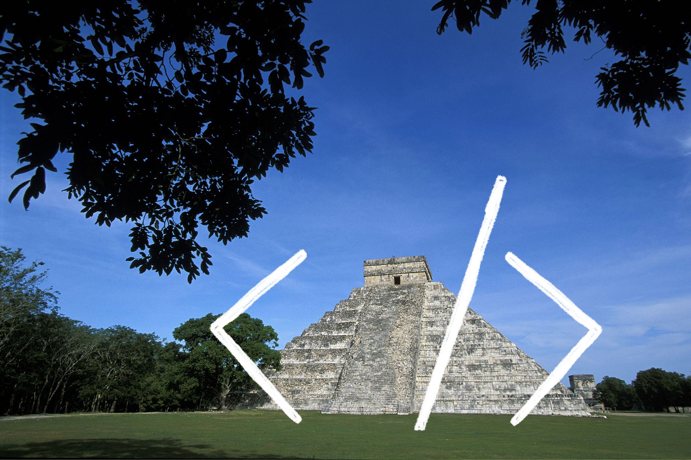 Chichen Itza overlaid with < /> code.