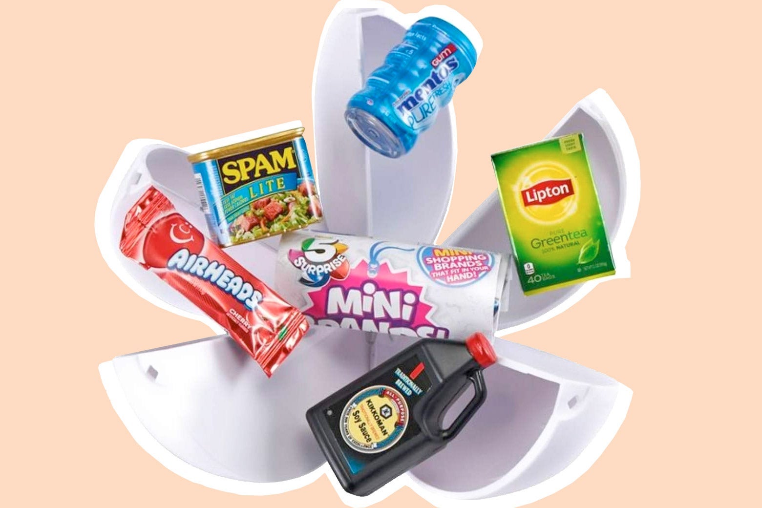 Five-segment spherical capsule bursting open with mini versions of a Mentos container, a Lipton tea box, a Kikkoman soy sauce bottle, an AirHeads package, and a Spam Lite can, with the 5 Surprise Mini Brands logo in the center