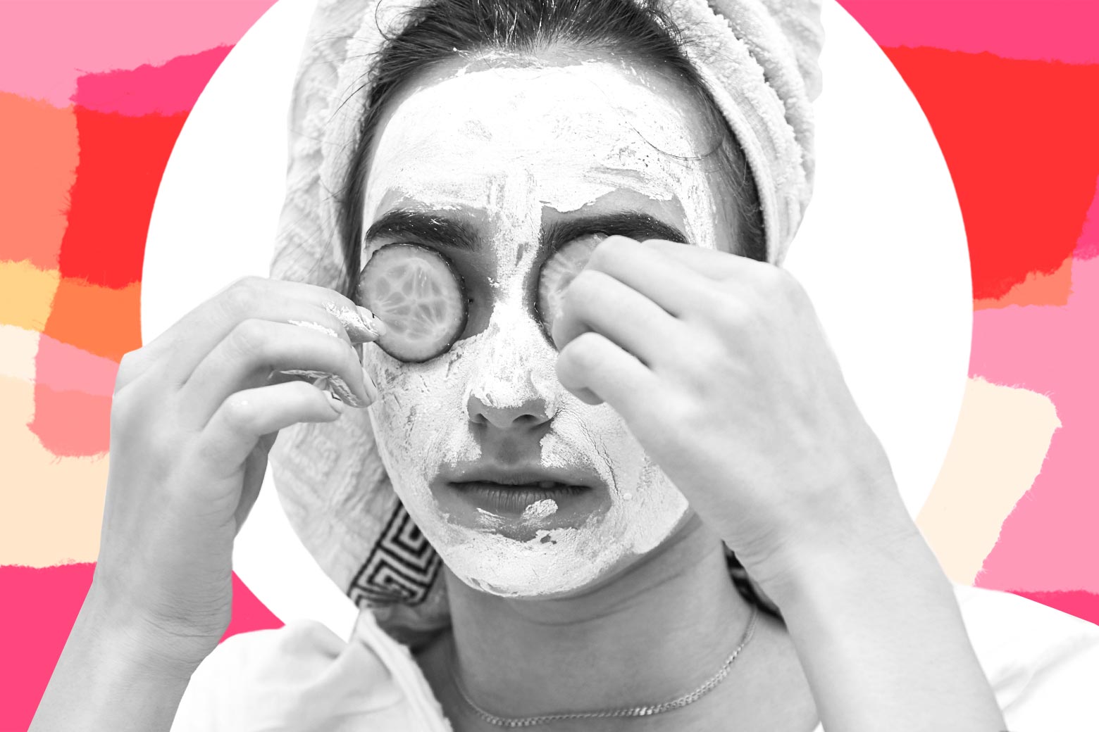 A woman gives herself a facial at home. 