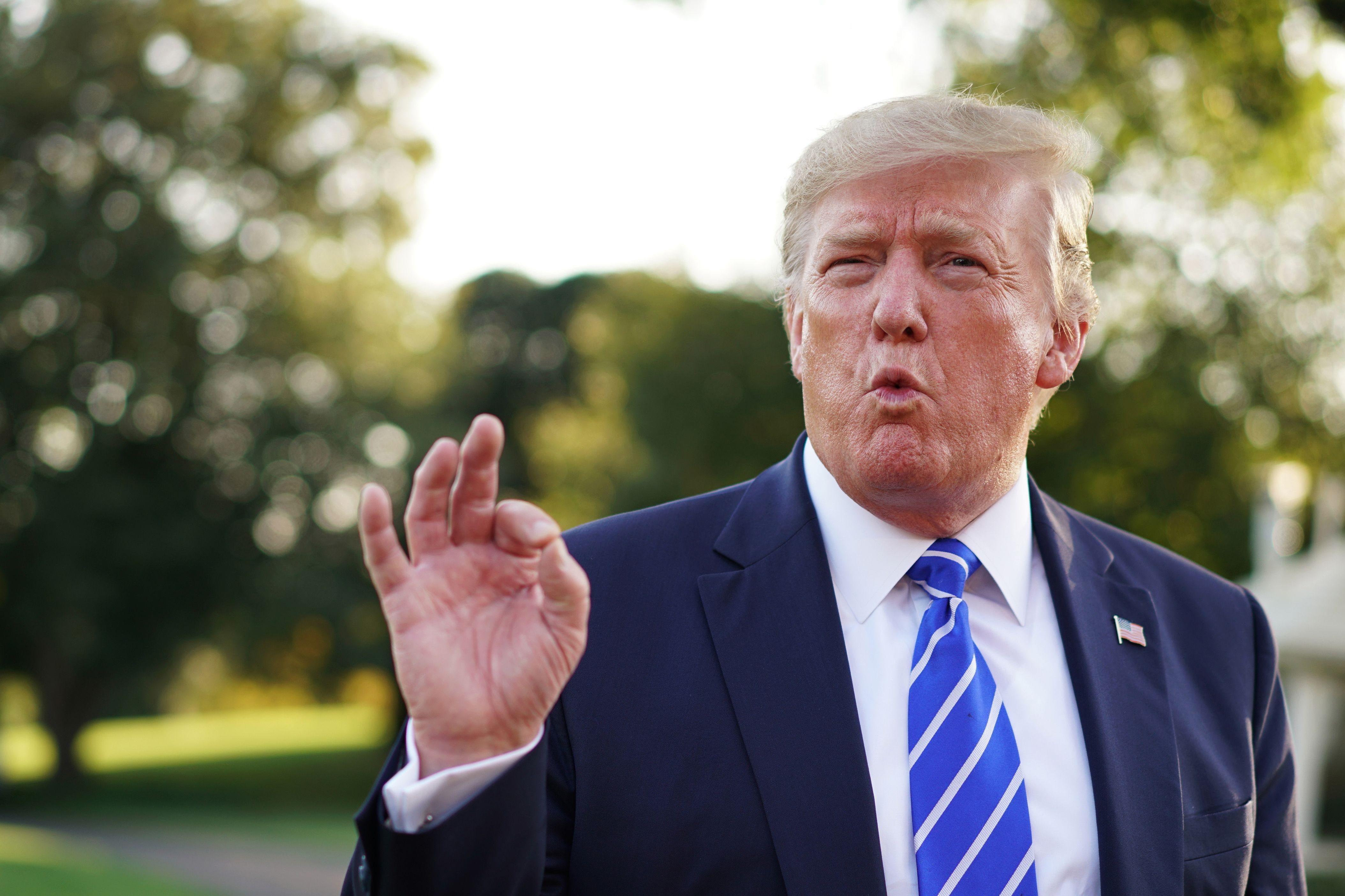 President Donald Trump speaks to the media before departing the White House for Camp David in Maryland on August 30, 2019. 