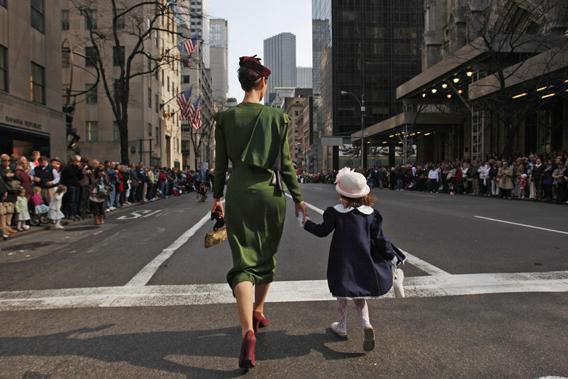 A mother and daughter walk down the Fifth Avenue in Manhattan at the Easter Bonnet Parade in New York April 4, 2010. 