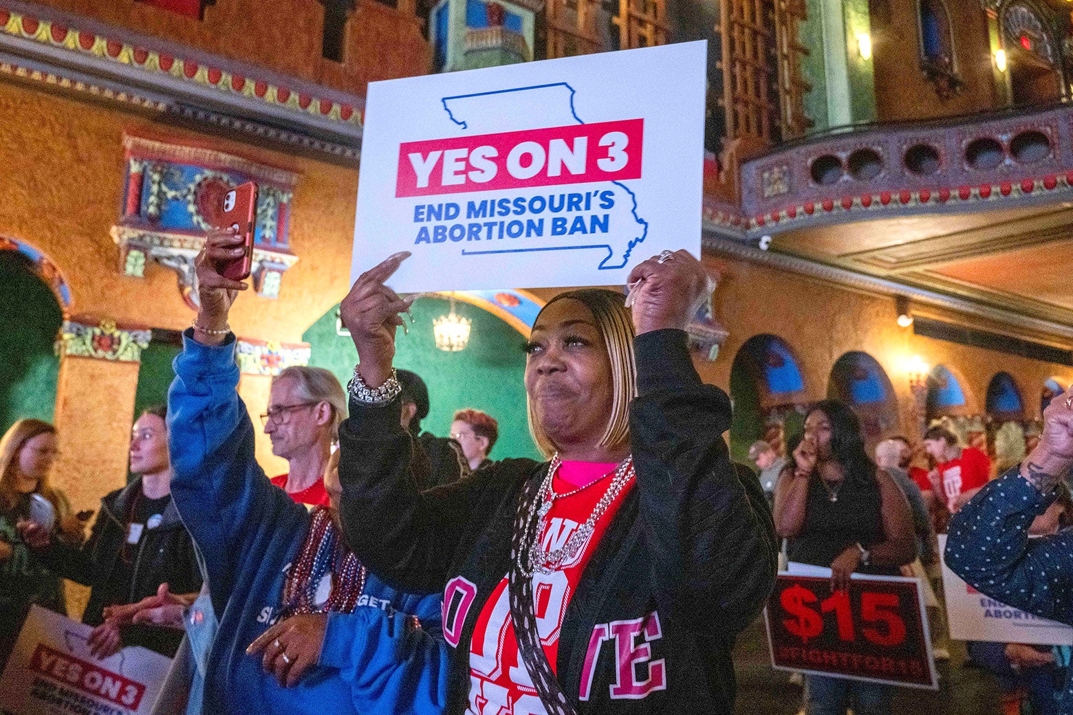 A voter holds up a sign 