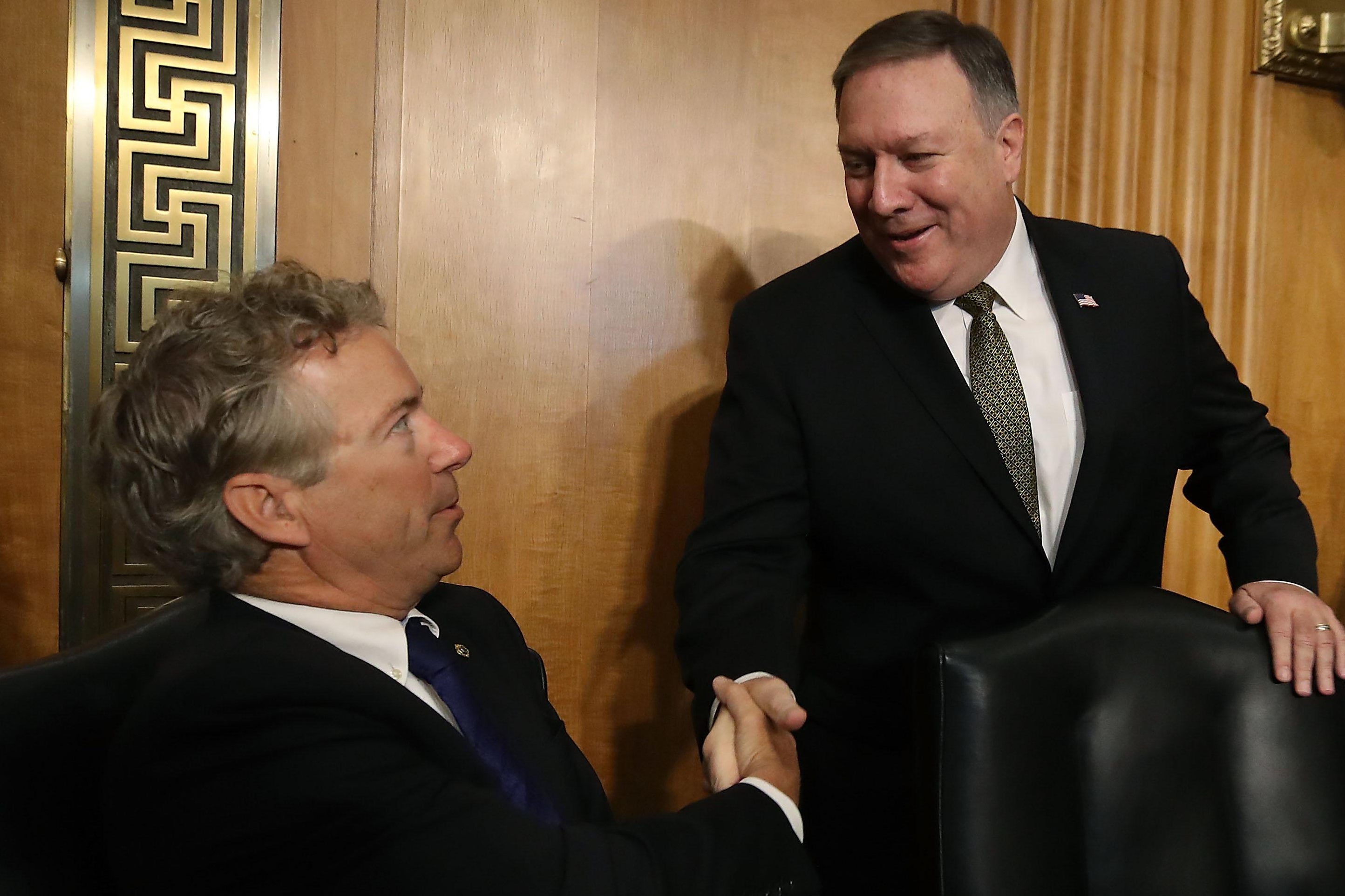 Rand Paul shakes Mike Pompeo’s hand.