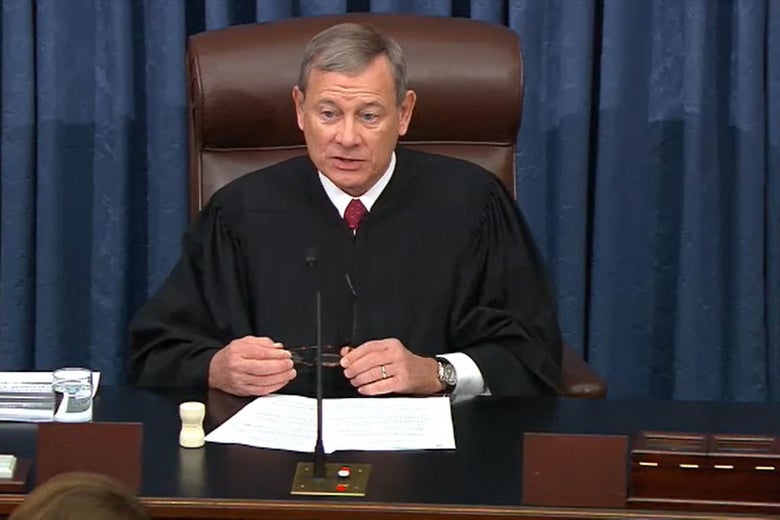 John Roberts in his robes, seated and addressing the Senate.