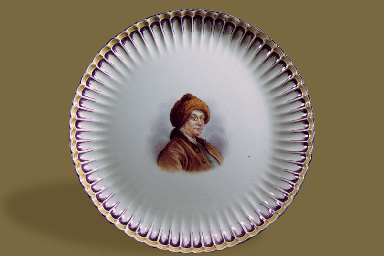Plate with an image of Franklin in the center wearing a fur hat and glasses