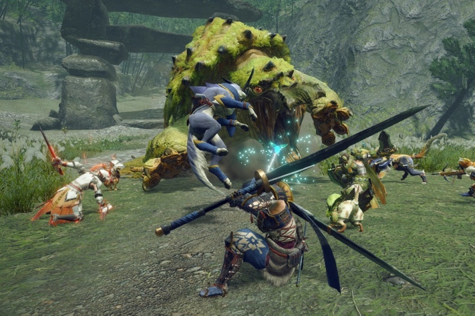 A group of warriors stand in a grassy field and fight against a large green monster. They are wielding swords.