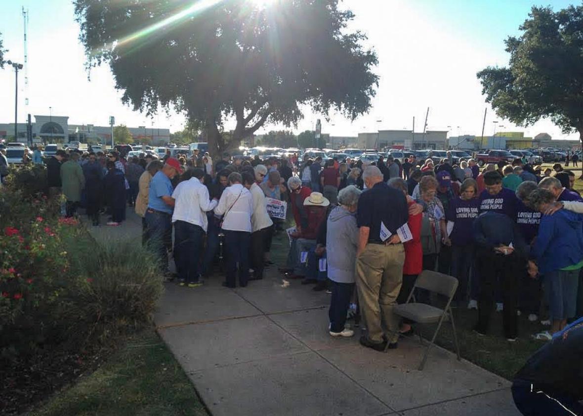 Prayer during a rally rally. 