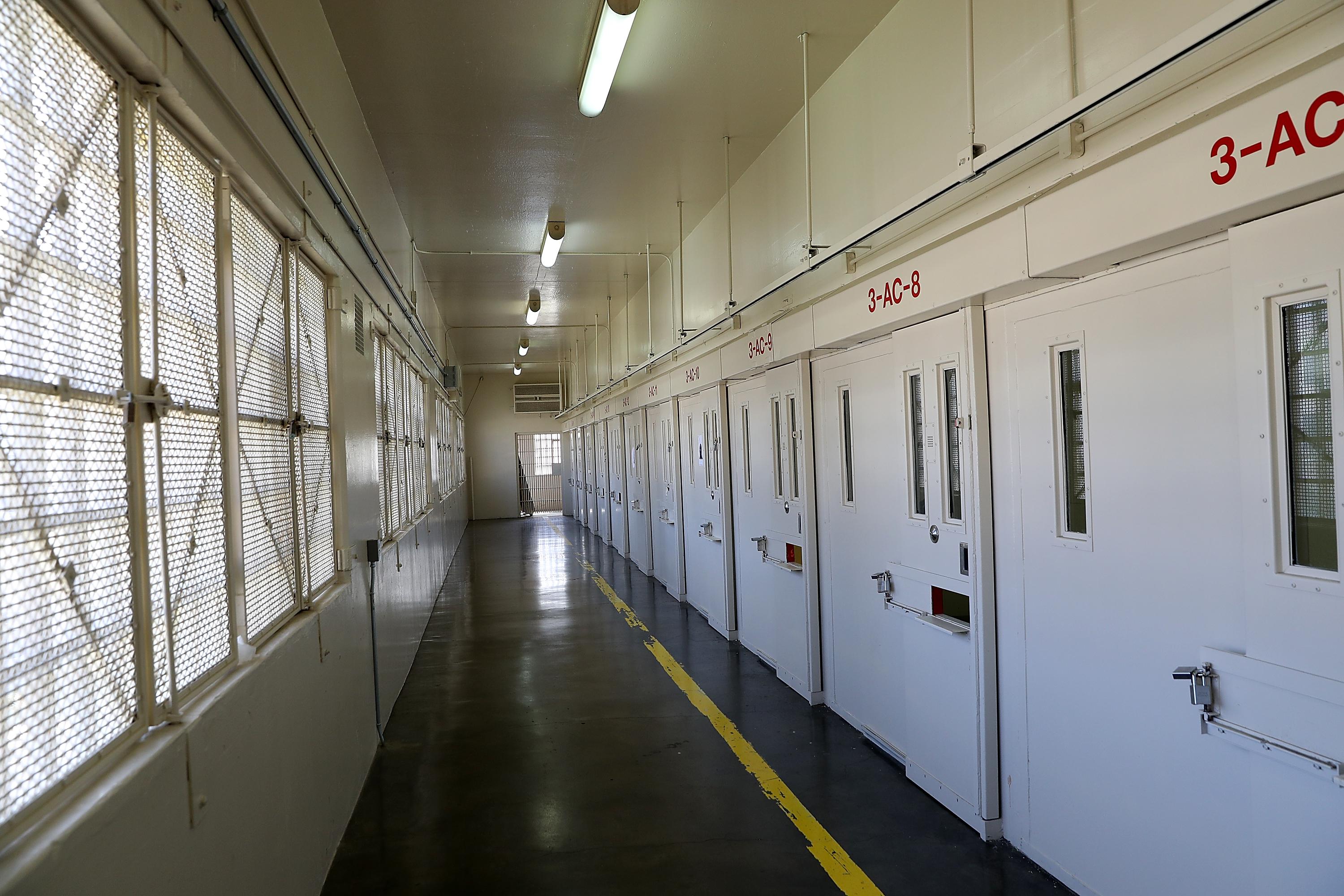 A row of cells doors and a hallway in San Quentin State Prison.