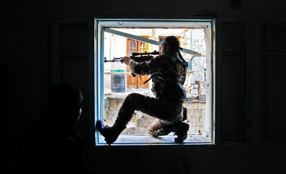 A member of Liwa (Brigade) Salahadin, a Kurdish military unit fighting along side rebel fighters.