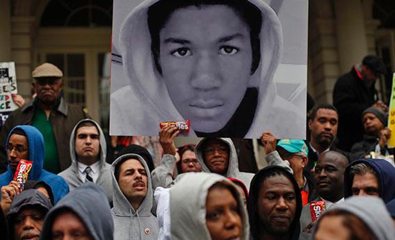 Members of the New York City Council wear "hoodie" sweatshirts as they stand together on the steps of City Hall in New York, March 28, 2012 to call for justice in the killing of 17-year-old Trayvon Martin.