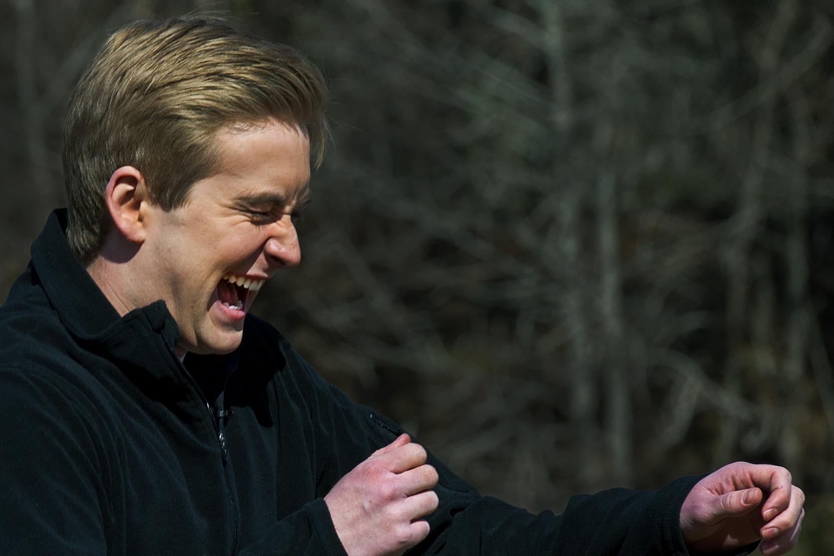 Peter Doocy grimaces as he's hit with a nonlethal directed energy weapon outdoors