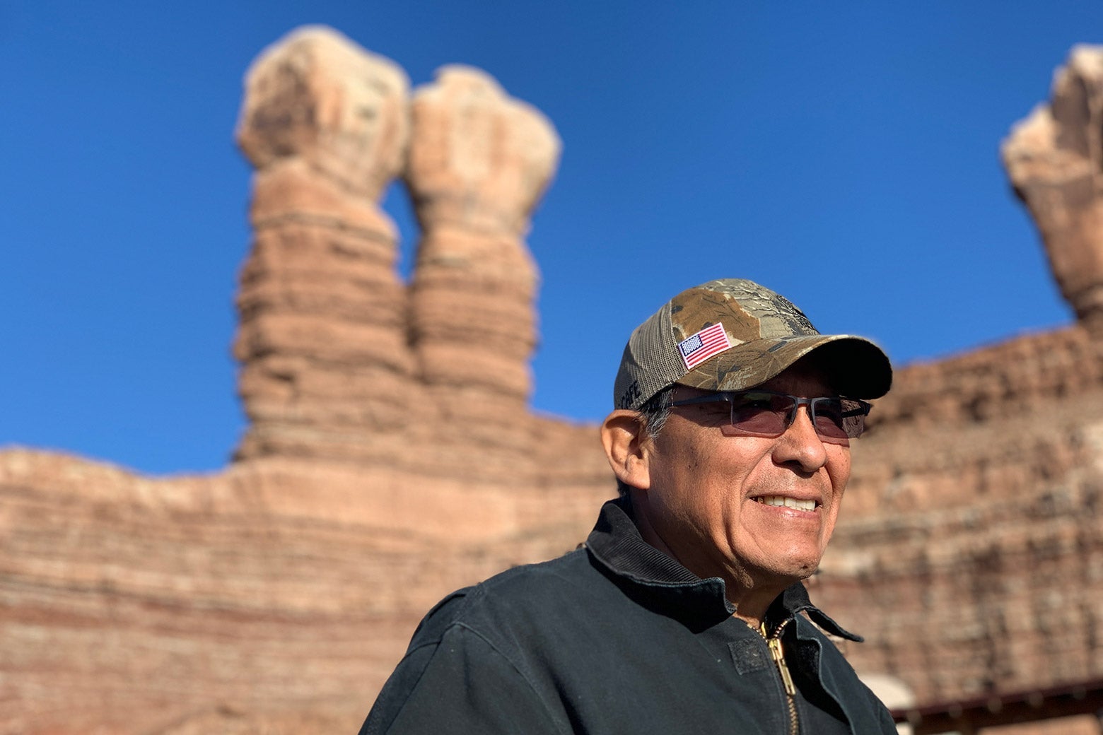 Mark Maryboy standing outside, below a Utah rock formation