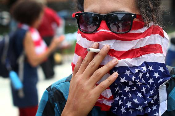 A member of Occupy DC smokes a cigarette after a march to mark the first anniversary of the movement.