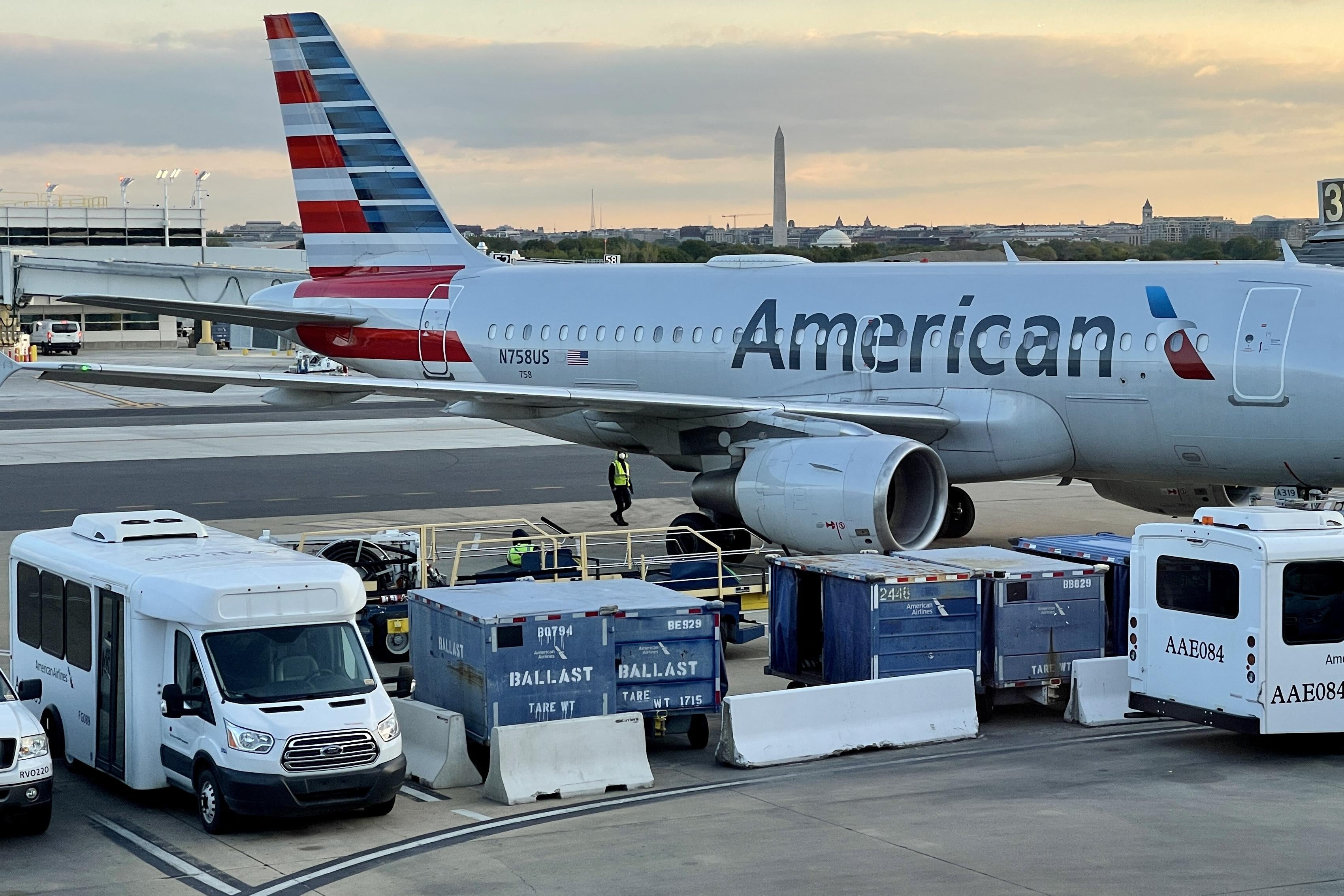 An American Airlines plane is seen at sunrise on the tarmac of the Reagan Washington National Airport (DCA) in Arlington, Virginia, on April 22, 2021. 