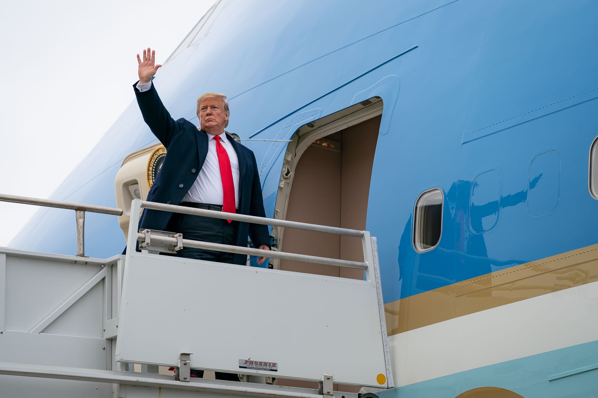 President Donald Trump boards Air Force One at Louis Armstrong New Orleans International Airport in Kenner, Louisiana on January 14, 2018.