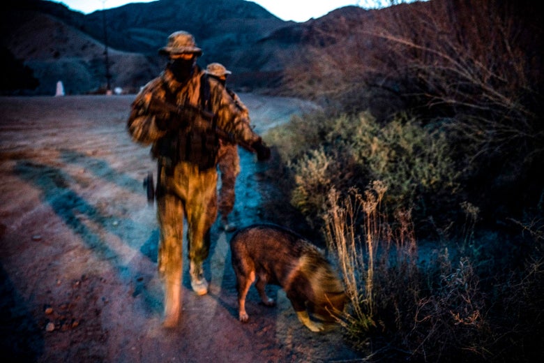 Viper and Stinger, members of the Constitutional Patriots New Mexico Border Ops Team militia who use aliases to protect their identity, patrol the U.S.-Mexico border in Sunland Park, New Mexico on March 20.