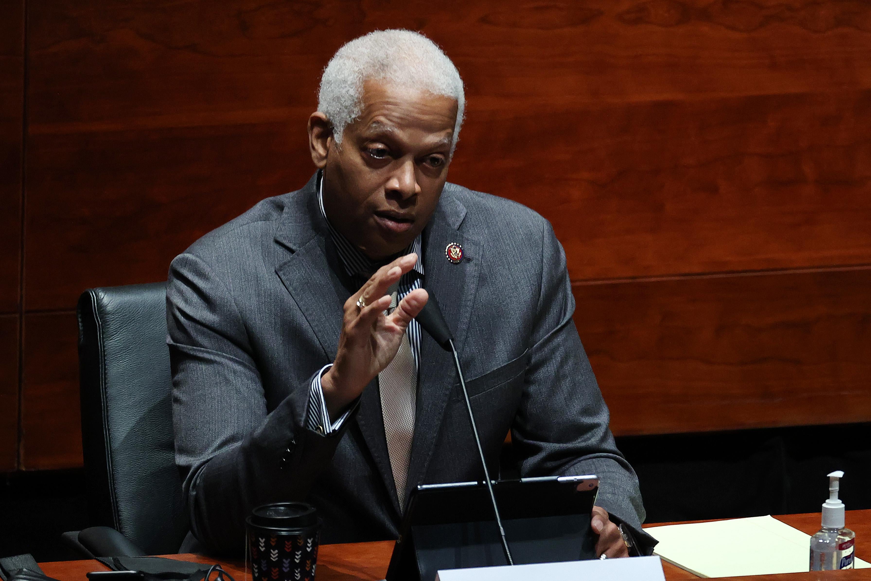 Rep. Hank Johnson speaks into a mic during a congressional hearing.