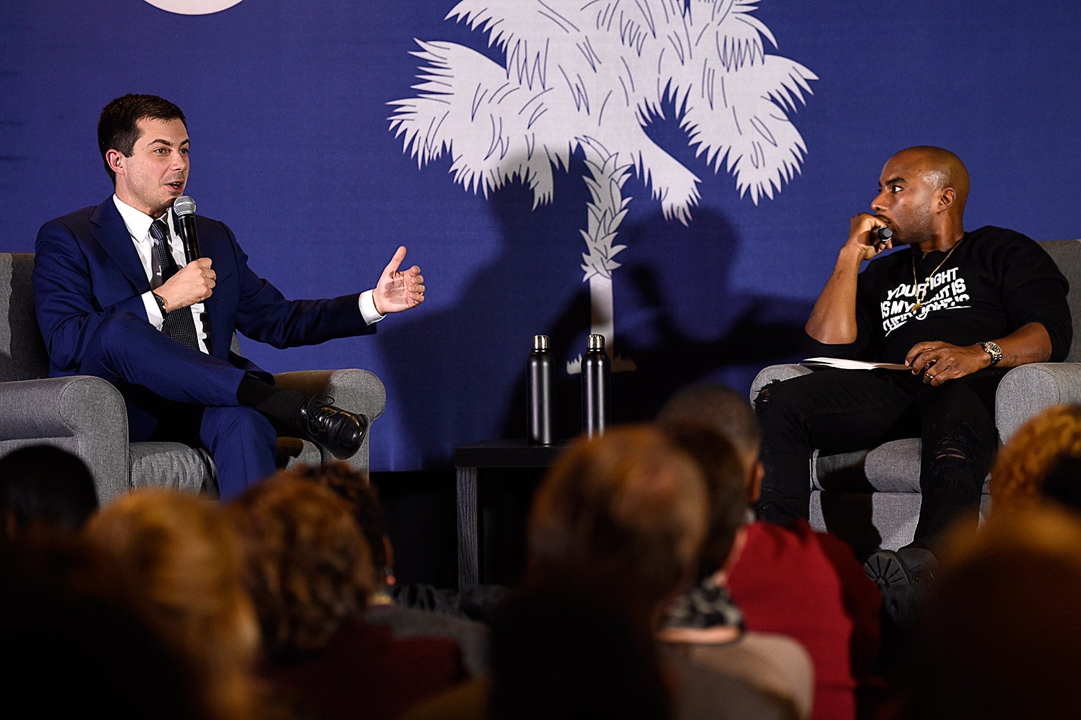 Pete Buttigieg speaks with Charlamagne tha God in front of an audience