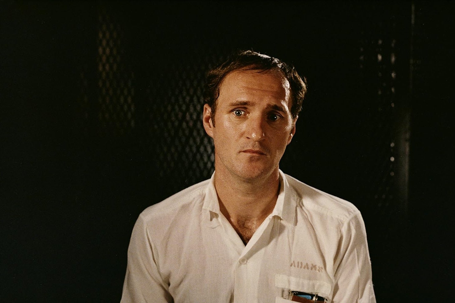 A portrait of Randall Adams in prison.