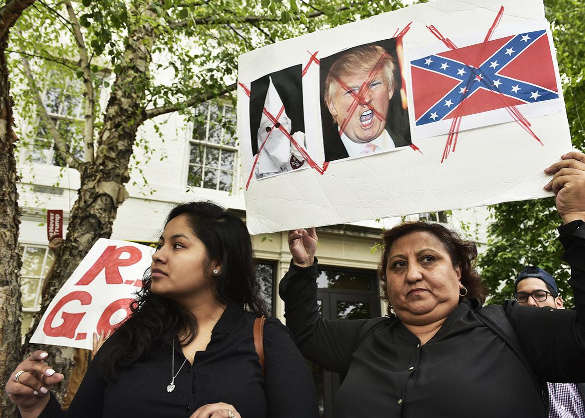Immigration rights activists protest outside of the Republican National Committee where Republican presidential candidate Donald Trump is meeting party leaders on Capitol Hill in Washington, DC on May 12, 2016.