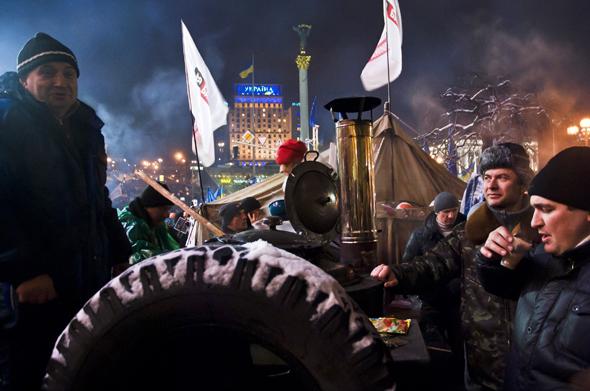Protesters drink free "hot Volyn tea" and eat hot soup at Independence Square.