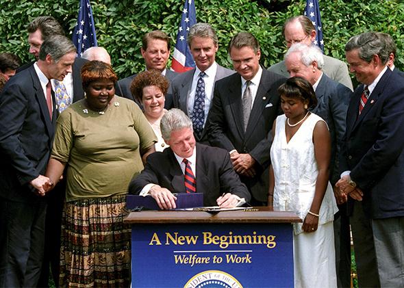 Bill Clinton signing Welfare to Work.