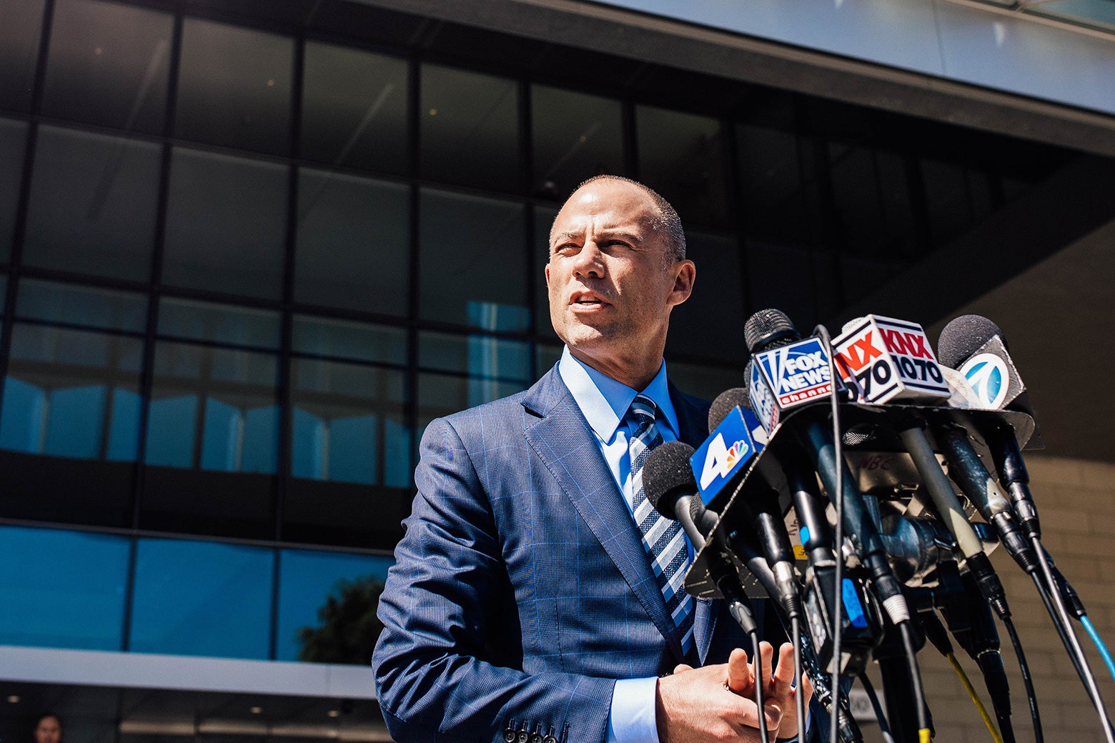 Michael Avenatti speaks to media in front of a Los Angeles courthouse.