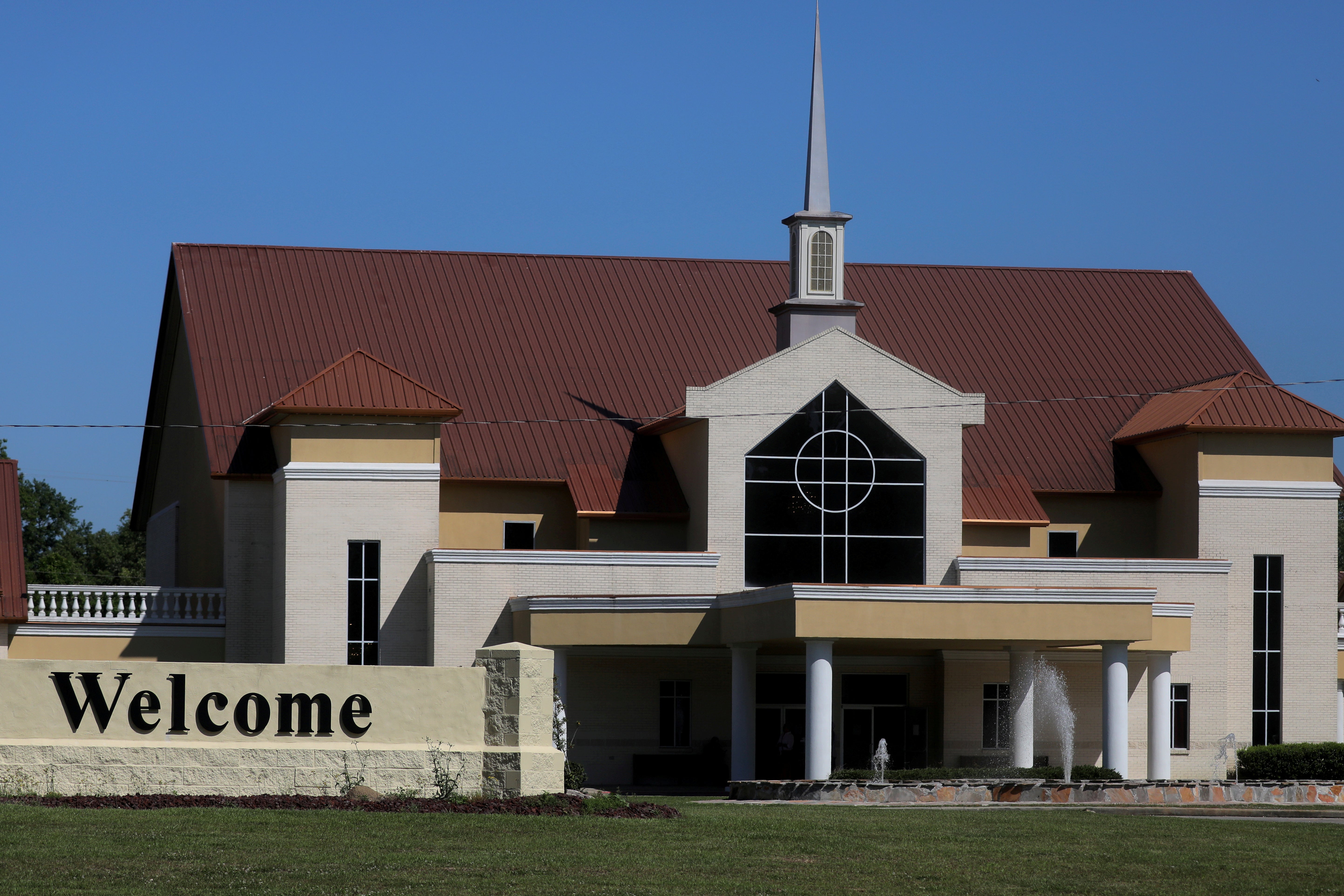 Exterior of church with welcome sign out front