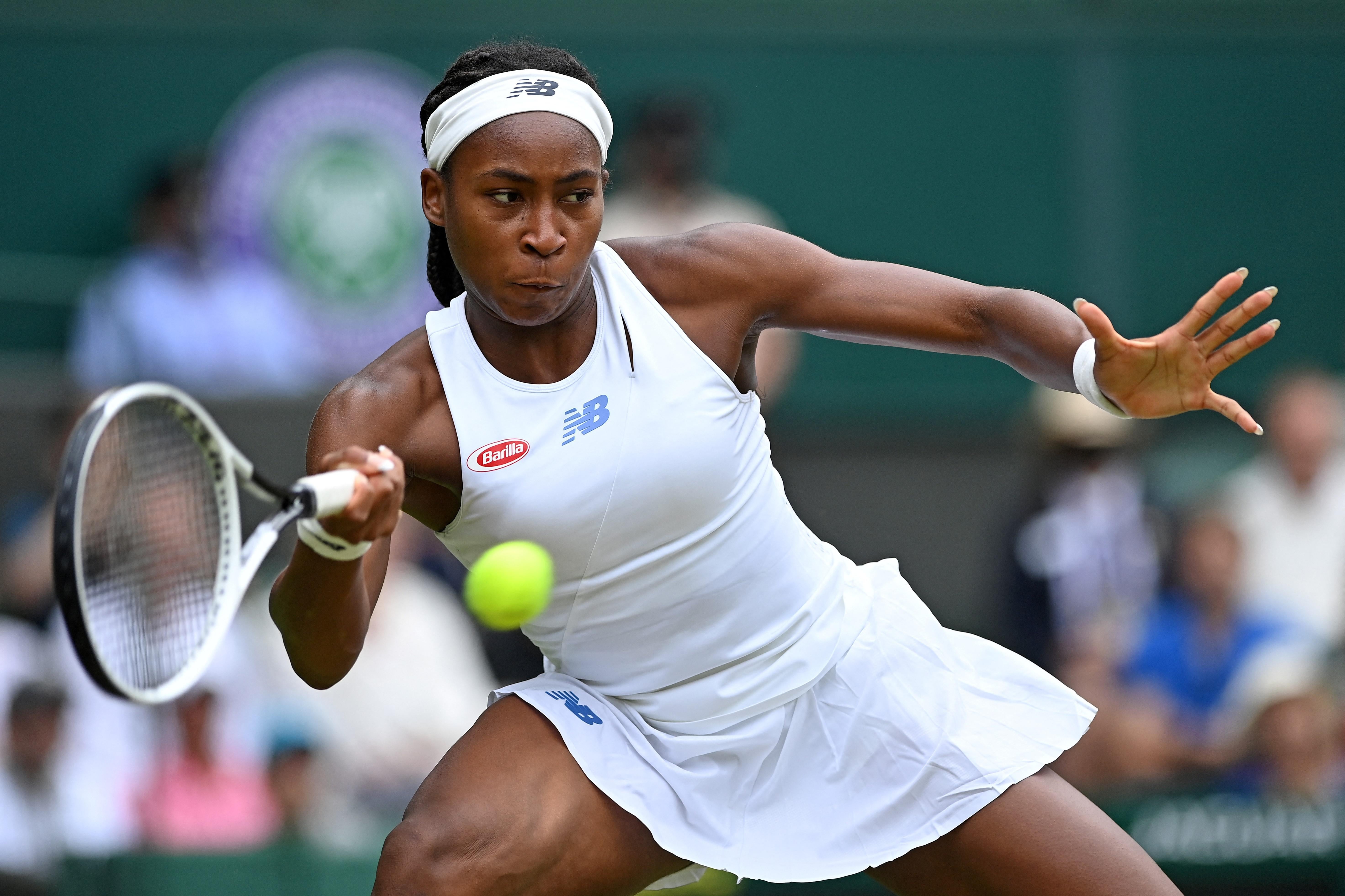 U.S. player Coco Gauff returns against Germany's Angelique Kerber during their women's singles fourth round match on the seventh day of the 2021 Wimbledon Championships at The All England Tennis Club in Wimbledon, southwest London, on July 5, 2021.