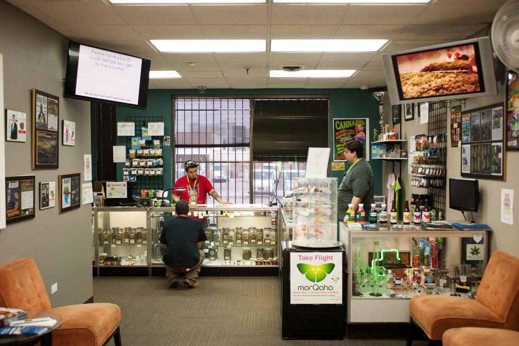 Jesse Rodriguez, left, a budtender, helps a customer on the medical side of the store.