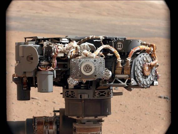 The Alpha Particle X-Ray Spectrometer (APXS) on NASA's Curiosity rover, with the Martian landscape in the background.