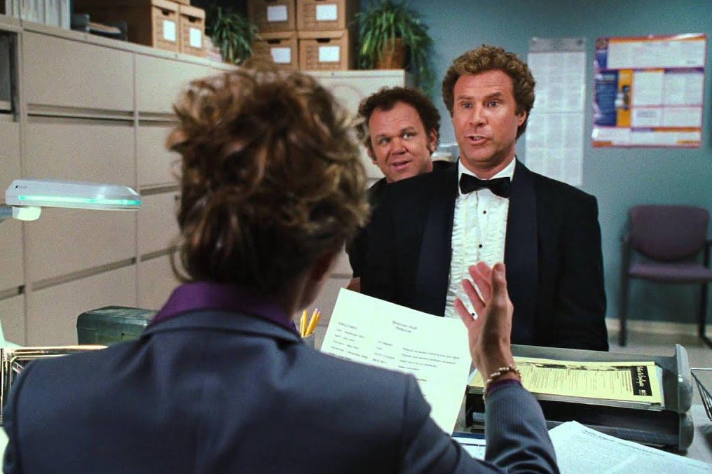 Will Ferrell and John C. Reilly wear tuxedos in a waiting room.