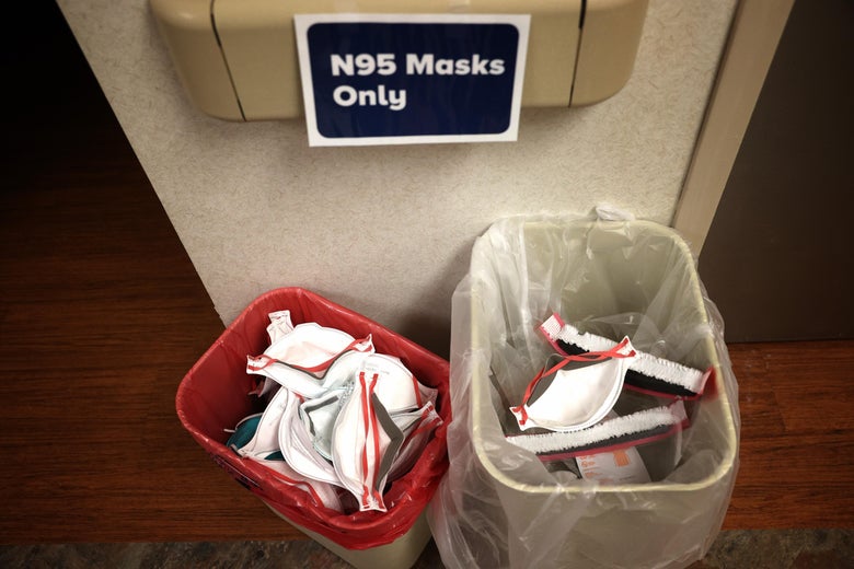 Two bins of N95 masks with a sign above that says "N95 Masks Only."