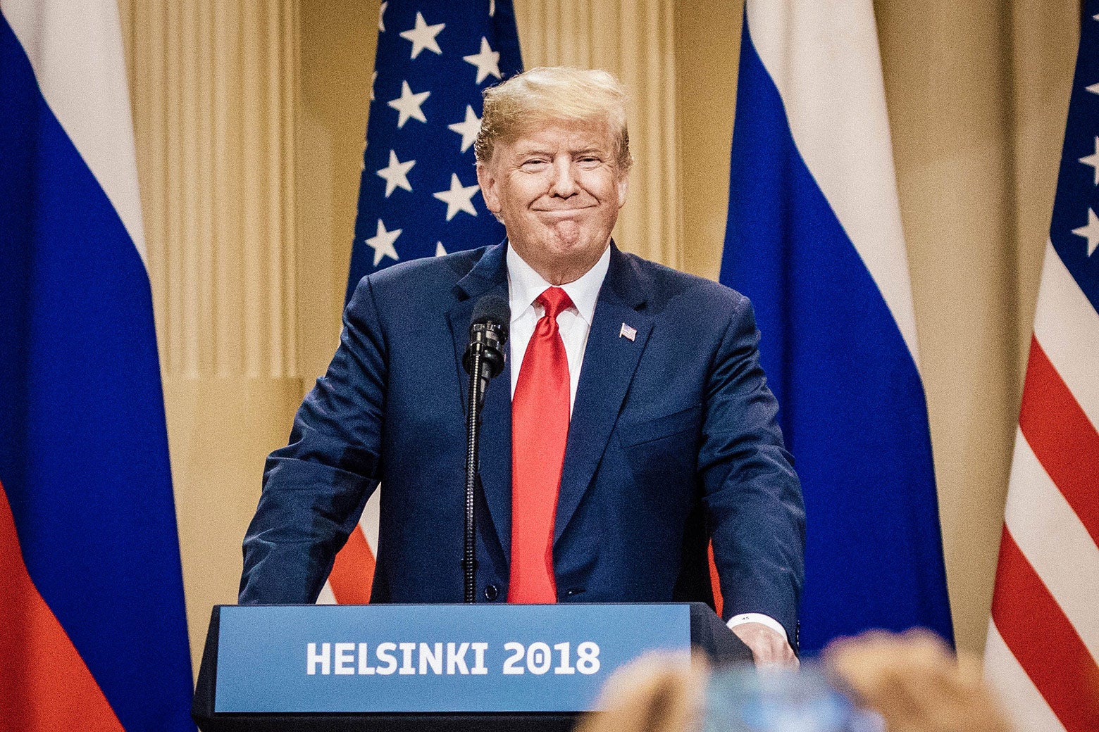 Donald Trump smirks at a press conference in Helsinki.