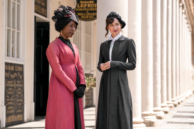 On the left, Amuka-Bird wears a pink period dress. On the right, Johnson wears a black dress and a black beret.